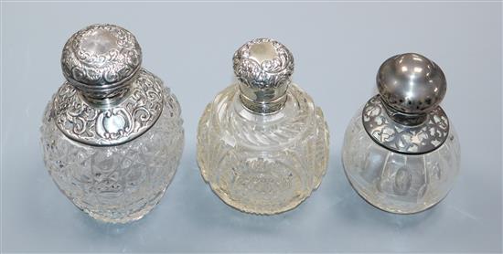 Three assorted silver or white metal mounted cut glass scent bottles, including Saunders & Shepherd, London, 1896,